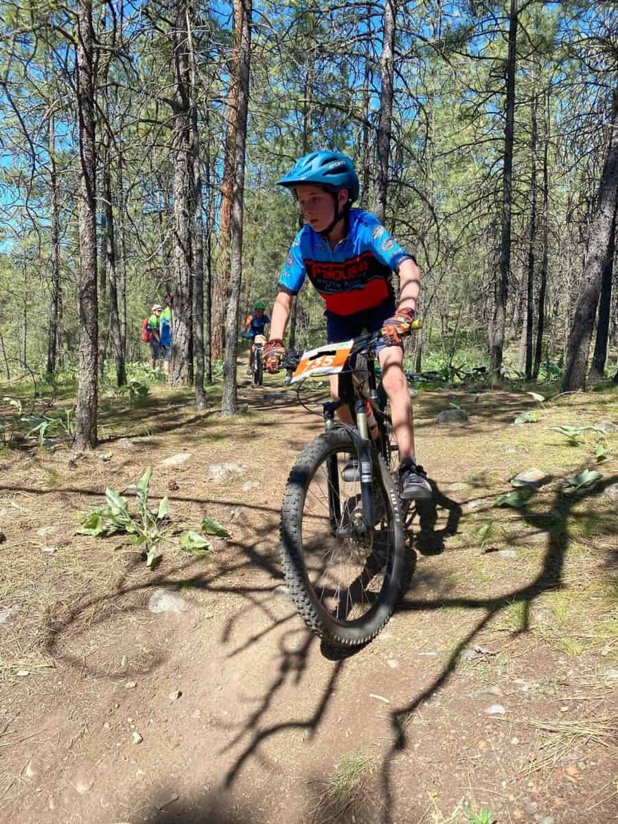 Student cyclist on the race course in a forest