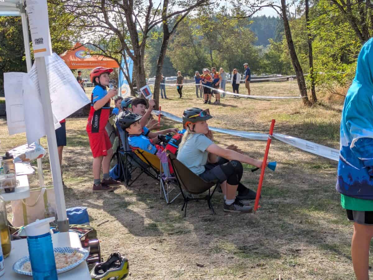 PBR team members cheering for a teammate on the course.